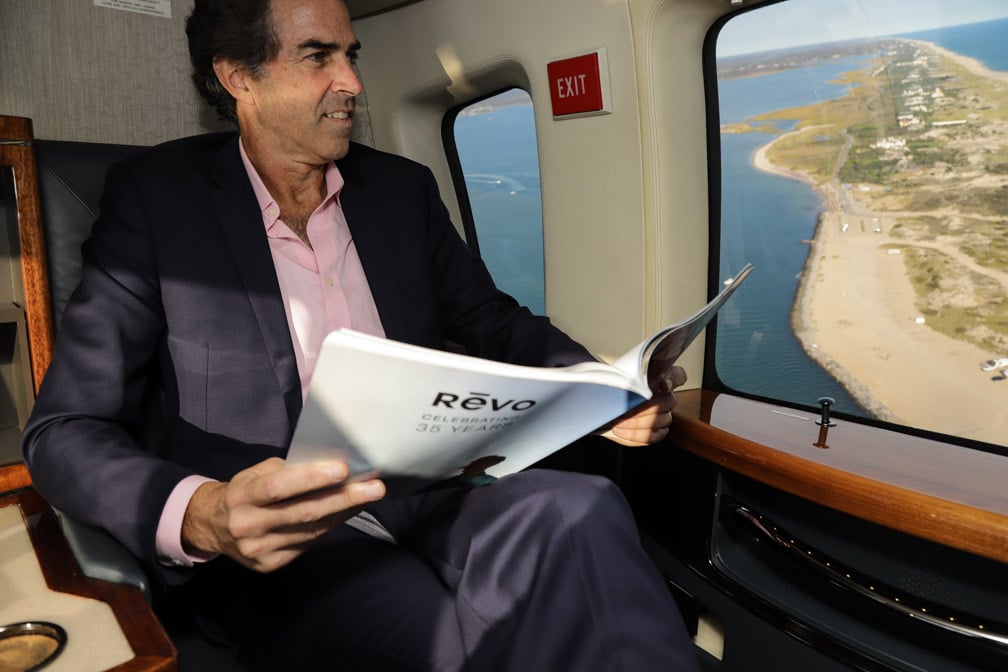 Businessman in a private helicopter charter by HeliFlite